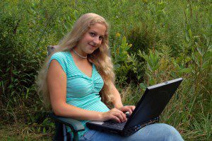 Student outdoors with computer (http://www.freeimages.com)